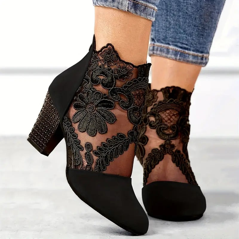 Women's LAKD elegant floral lace ankle boots with block heels, showcasing intricate lace details and stylish design.